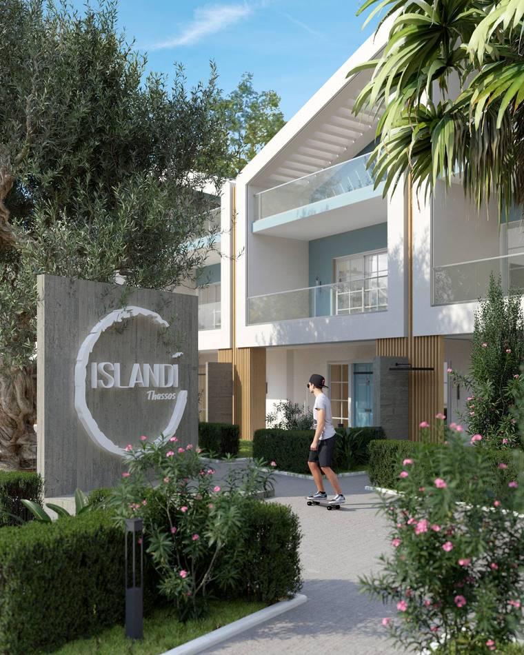 Projenin beton giriş tabelası ve zeytin ağacı